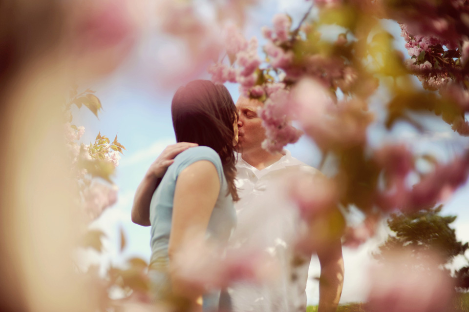 engaged couple kissing