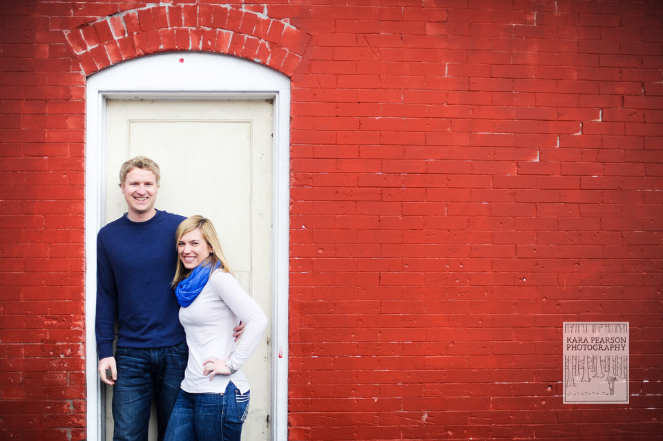 Engagement shoot against red wall