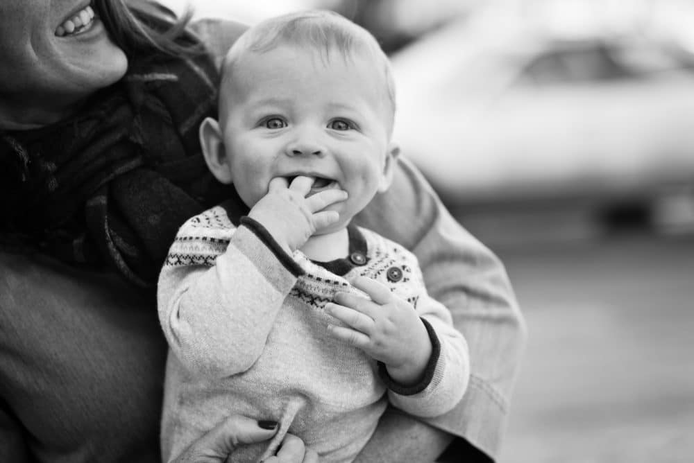 smiling baby in black and white