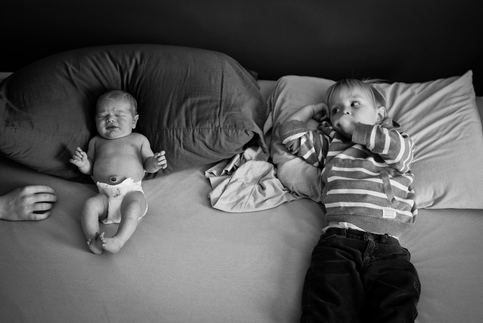 brothers lying in bed