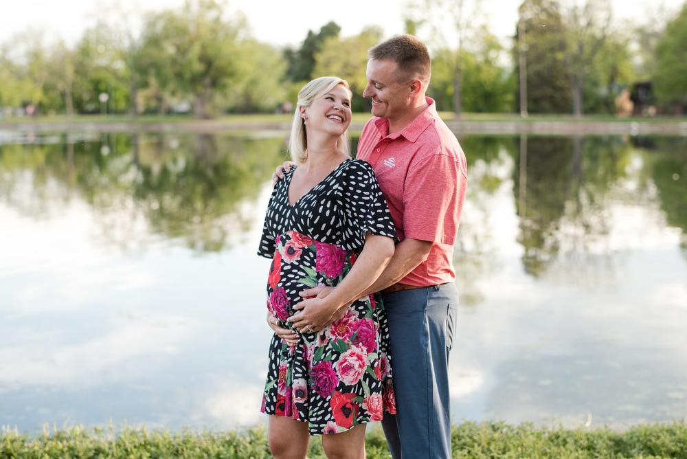 A couple poses in Wash Park for their Denver maternity portraits